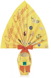 Uovo di Pasqua Caffarel al latte con sorpresa Thun. Incarto giallo decorato con fiocco arancio.