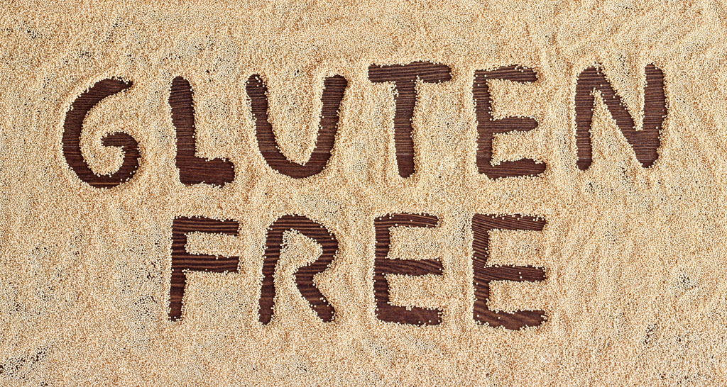 Testo Gluten Free su fondo di semi. Senza glutine, alimentazione sana.