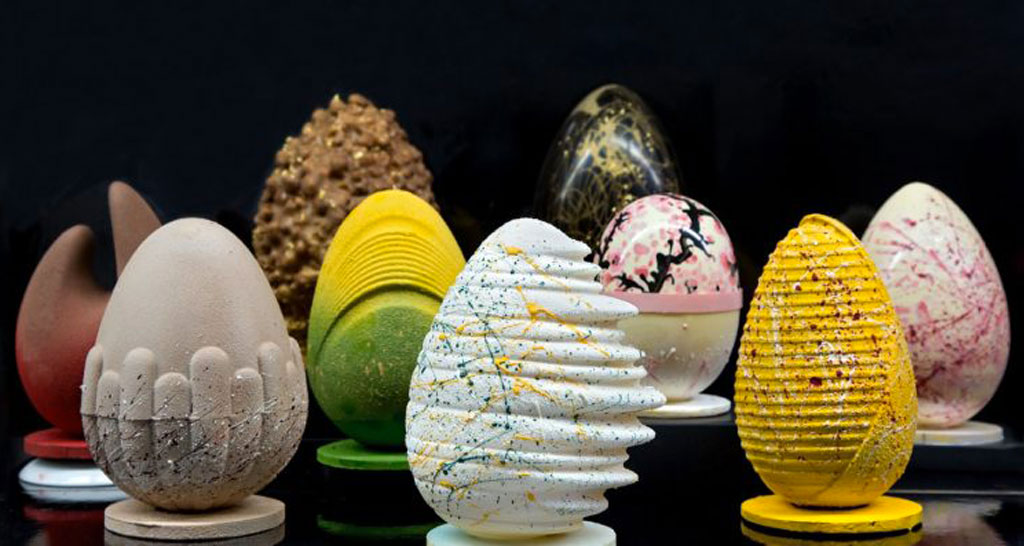 Uova di Pasqua artigianali decorate. Dolci pasquali unici e colorati, perfetti per la festa. Cioccolato di alta qualità.