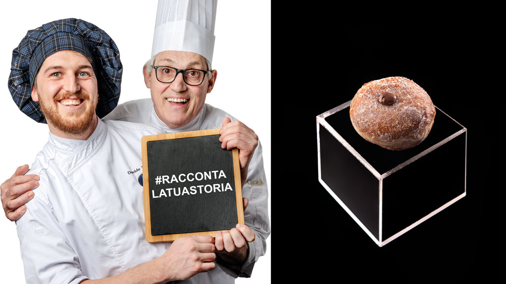 Chef sorridenti con cartello #raccontalatua storia e bombolone su piedistallo. Pasticceria artigianale.
