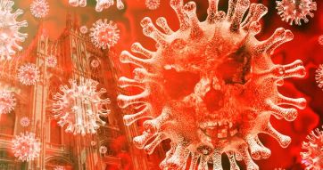 Coronavirus a Milano. Immagine del virus COVID-19 con il Duomo sullo sfondo. Pandemia e salute.