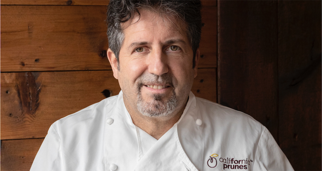 Chef con divisa California Prunes. Prugne della California, alta qualità.